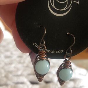 Artisan copper dangle earrings with pale blue aquamarine stones.